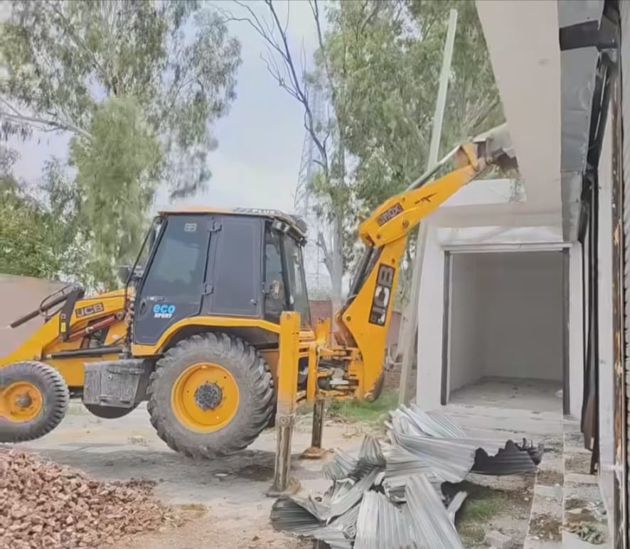 Bulldozers run on illegal constructions behind Ramdhan Petrol Pump, several shops demolished