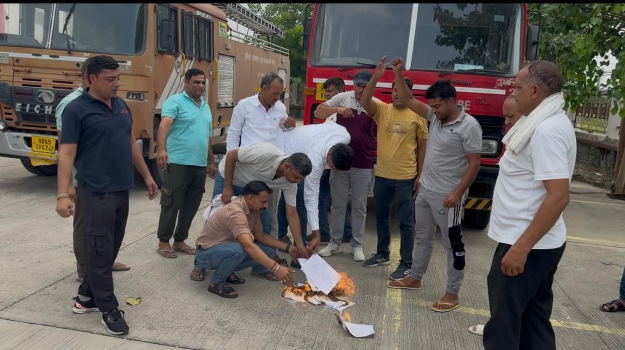 Firefighters staged a protest by burning copies of the job security letter.