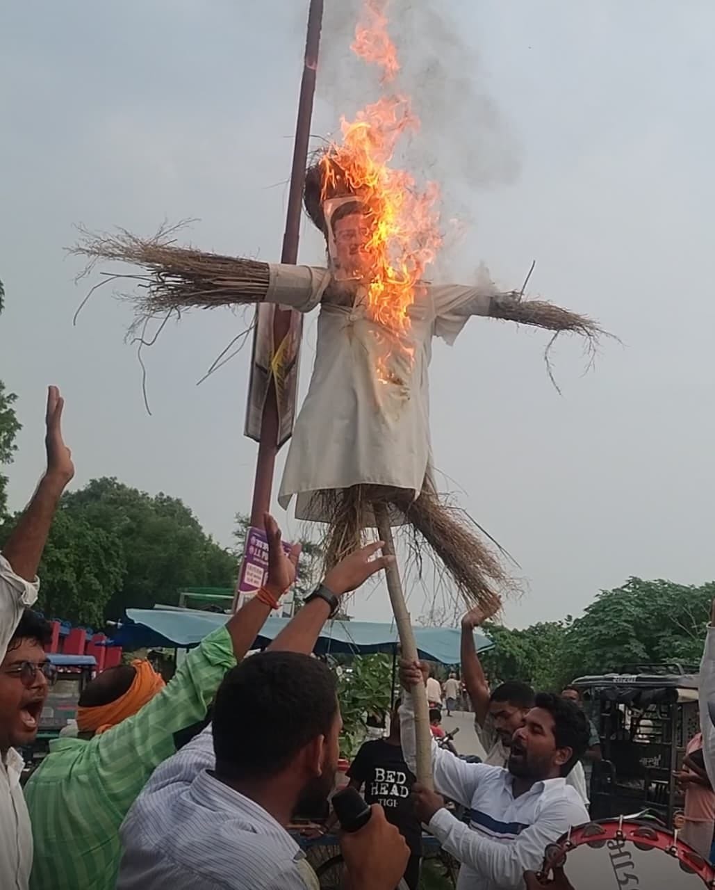 Police chased away youths who were burning an effigy of Dharmendra Pradhan.