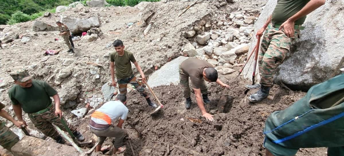 Machinery could not reach the site; Army personnel are engaged in clearing debris using pickaxes and shovels.
