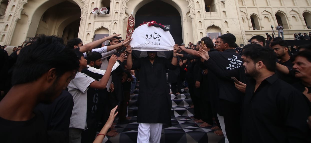 Devotees immersed in the memory of the 72 Martyrs of Karbala.