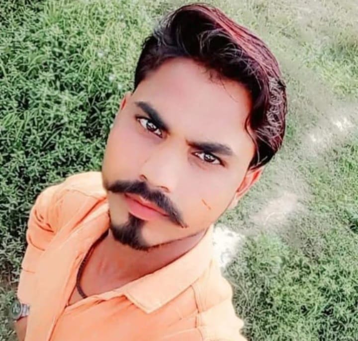 Youth found hanging from tree; murder alleged.