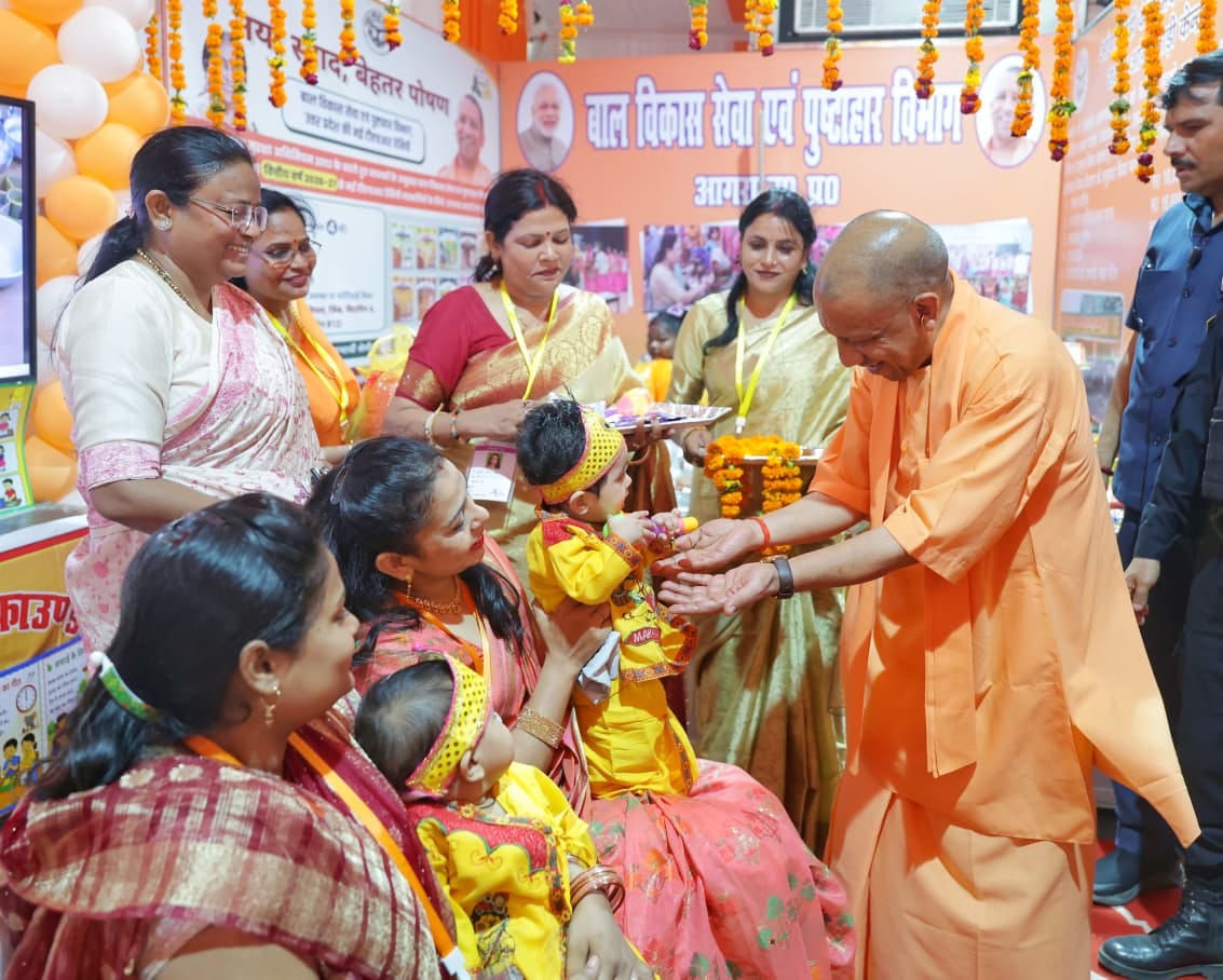 The children did not get down from Yogi's lap after the *Annaprashan* ceremony... applause rang out.