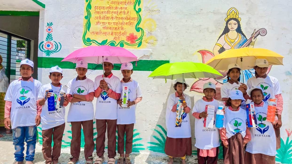 Umbrellas and bottles distributed to students.