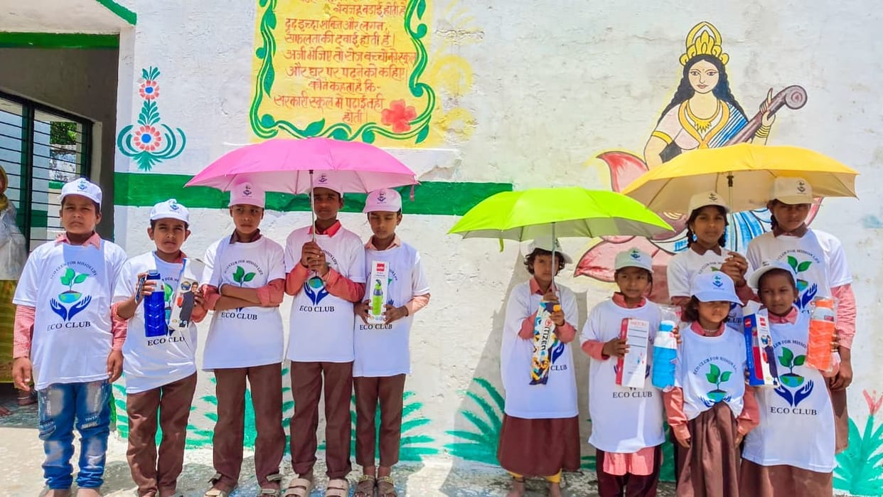 Umbrellas and bottles distributed to students.