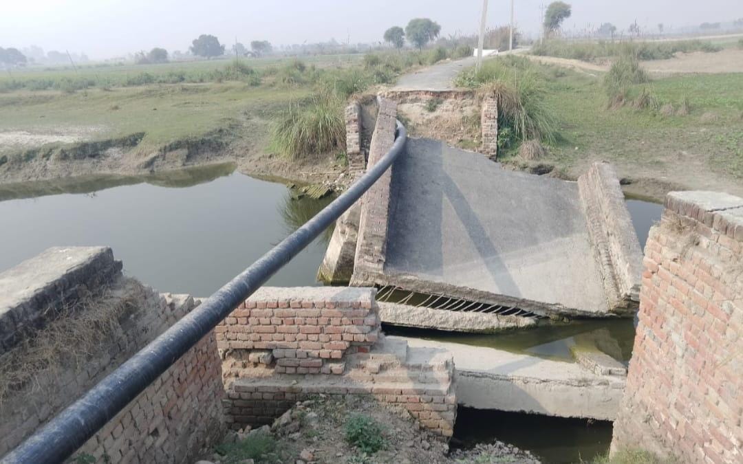 Roads and bridges damaged last year remain unrepaired; villagers worried about the threat of floods.