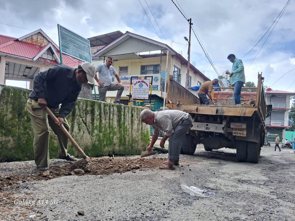 Potholes filled with soil; people's woes persist.