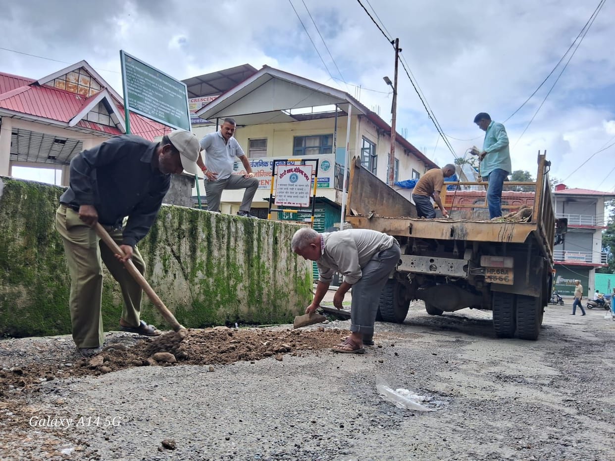 Potholes filled with soil; people's woes persist.