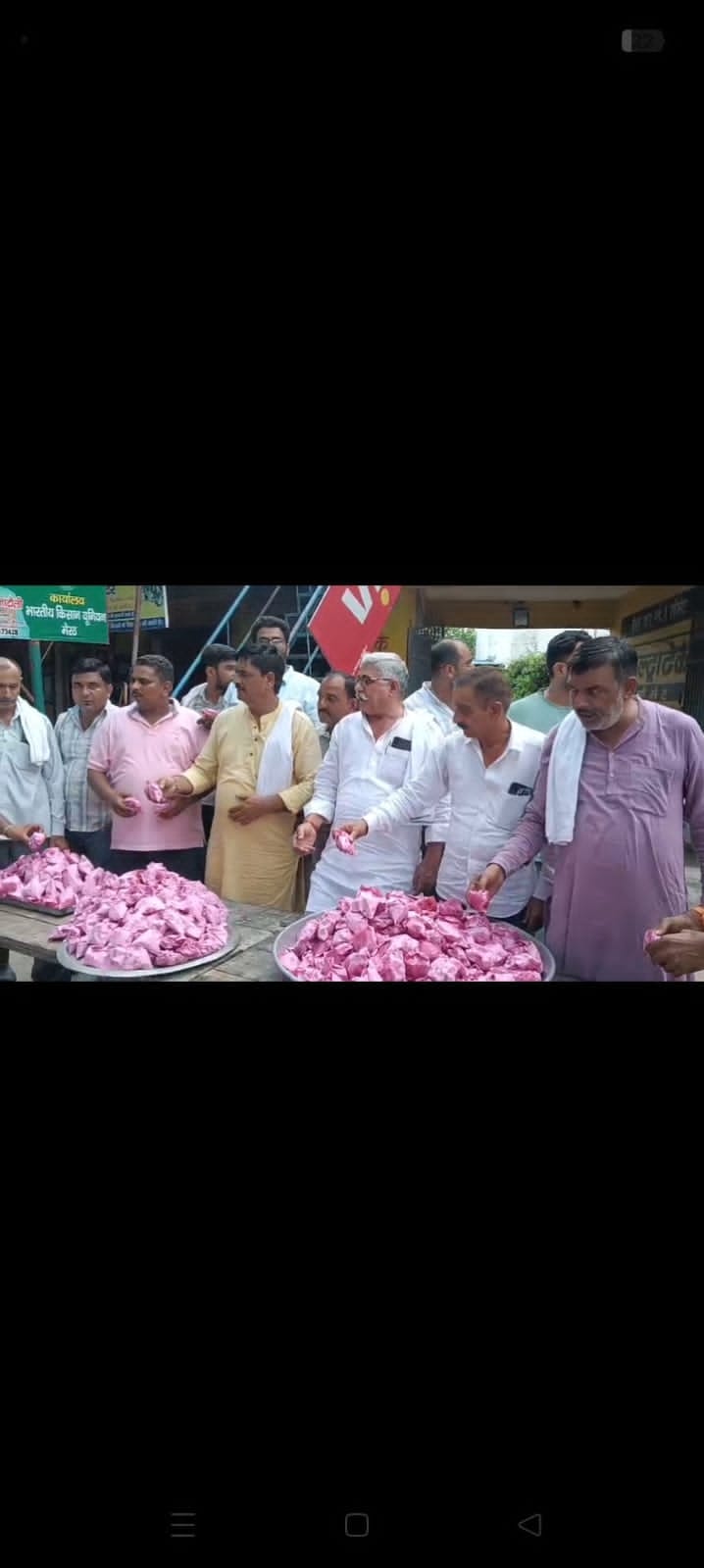Farmers distributed *prasad* over the Education Minister's resignation.