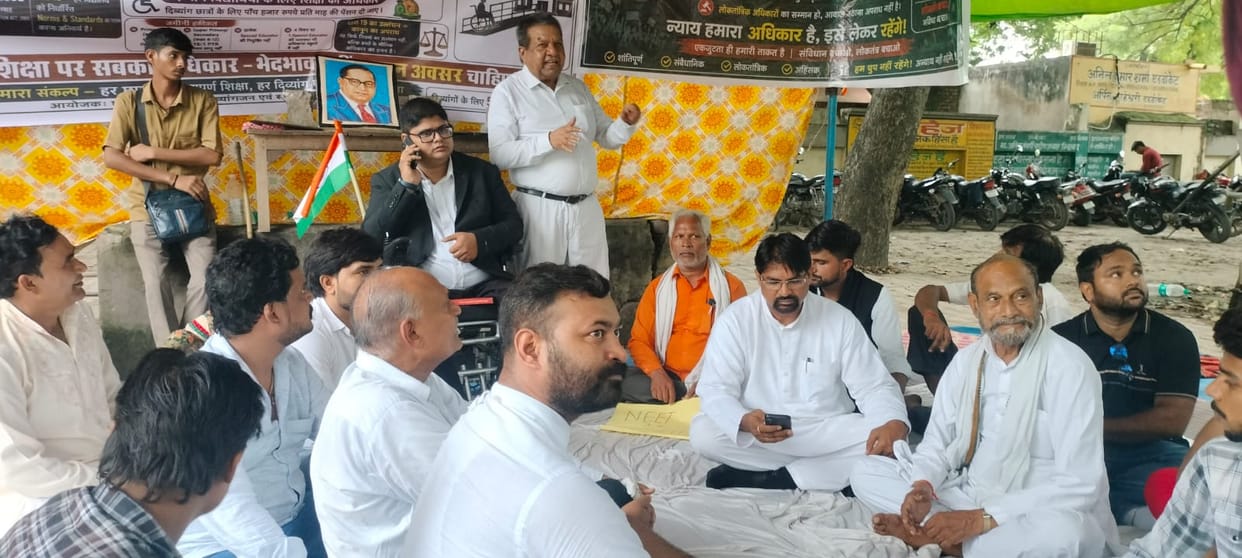 Indefinite sit-in protest by differently-abled individuals begins, demanding equal education and transparent examinations.