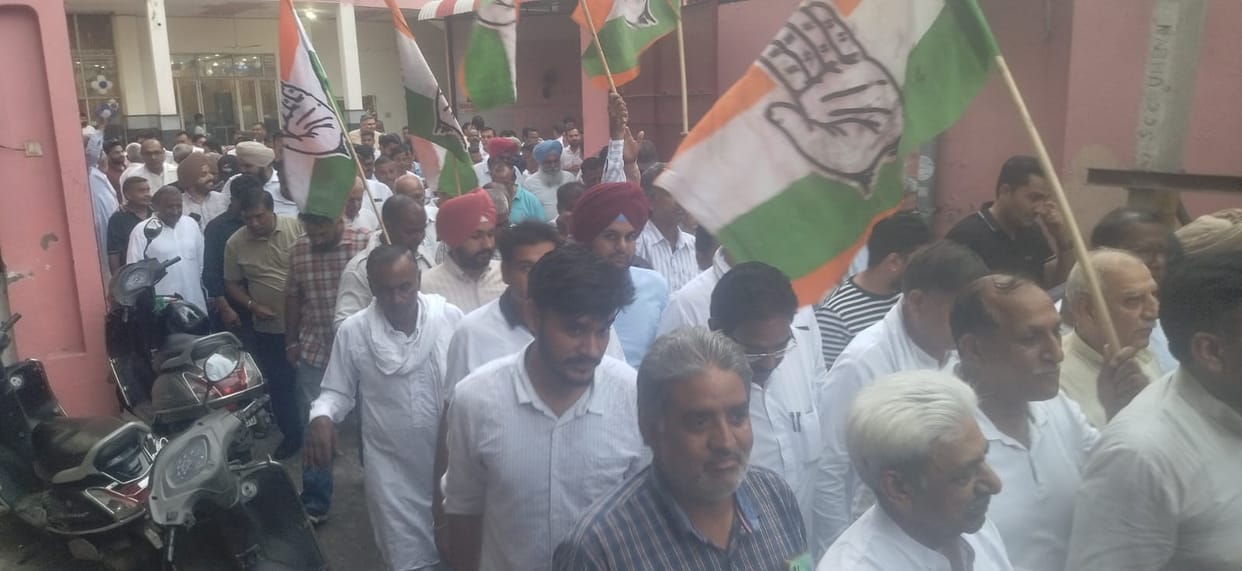 A candlelight march was planned; Congress workers celebrated when the Union Education Minister resigned.