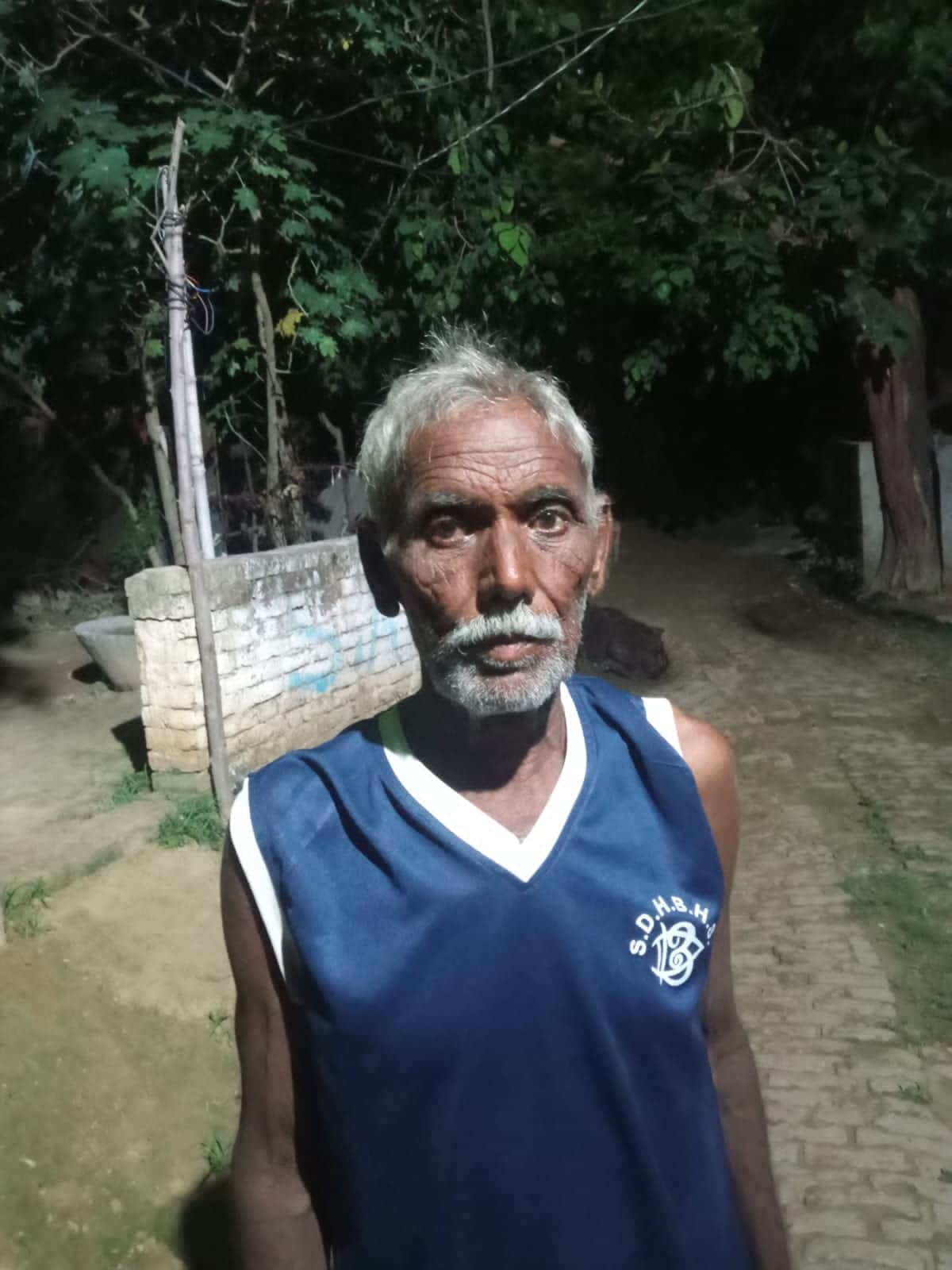 Farmer cutting fodder in field attacked by wild animal