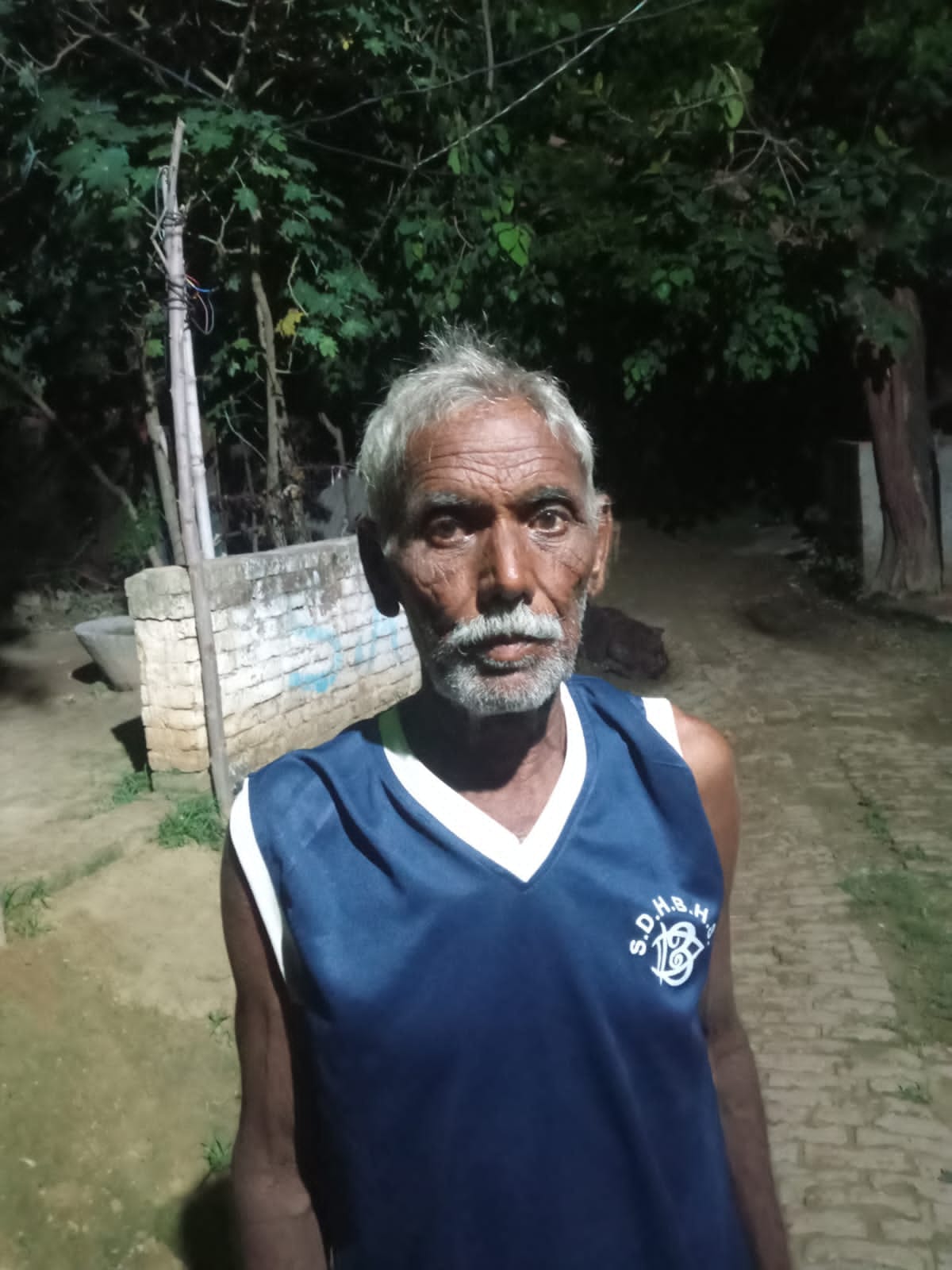 Farmer cutting fodder in field attacked by wild animal