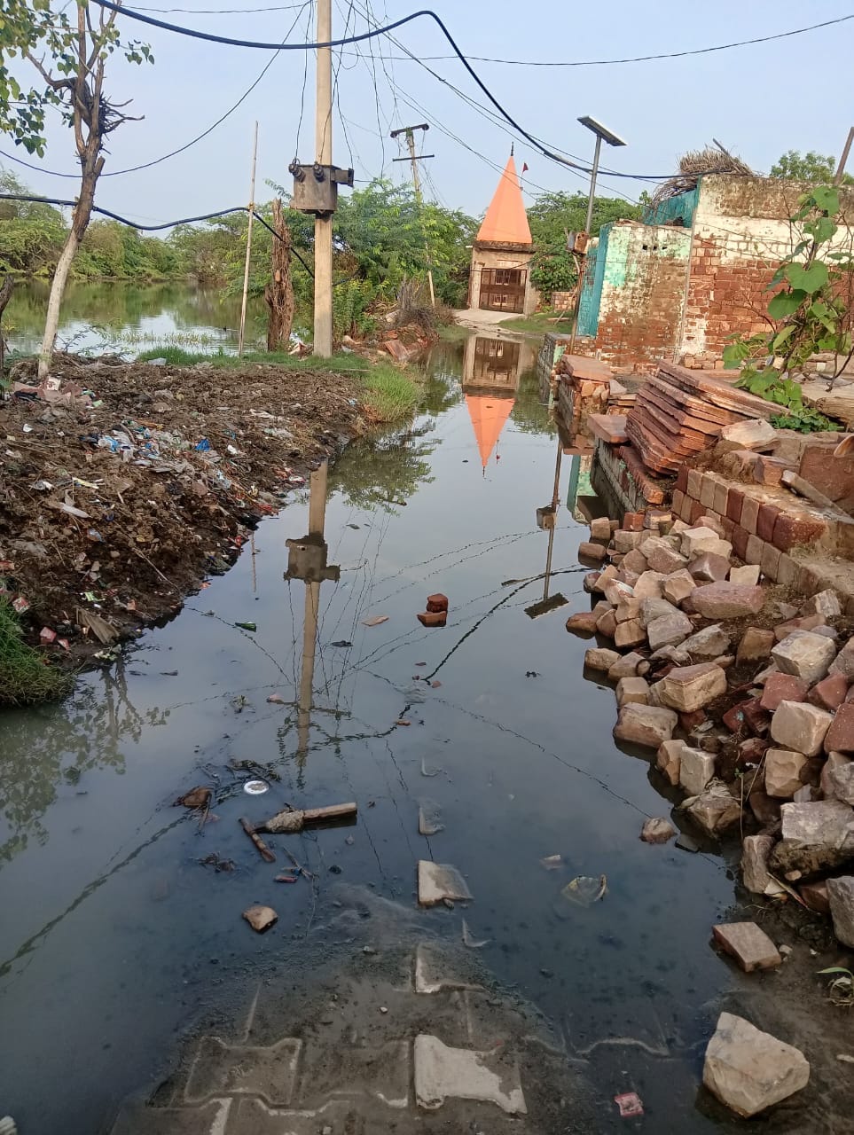 Foul-smelling water entered homes; the path to the temple was blocked.