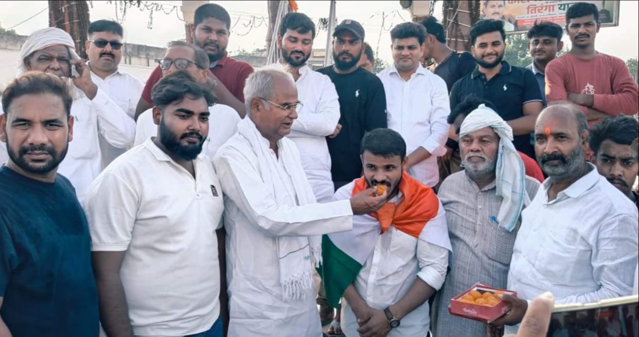 Students celebrated by distributing sweets following the Education Minister's resignation.