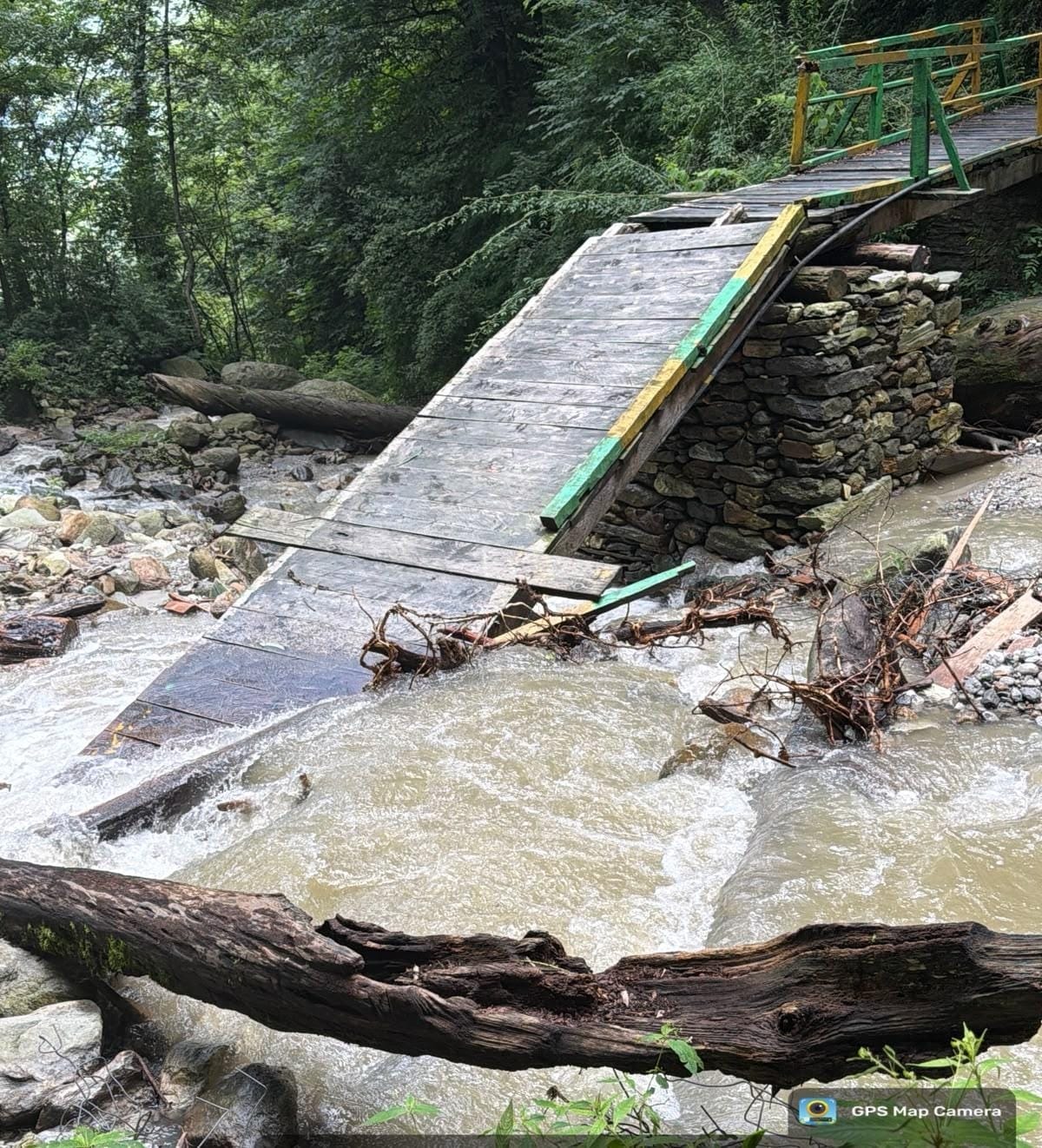 A cloudburst washed away a temporary bridge and a road in the Dhoundhal drain.