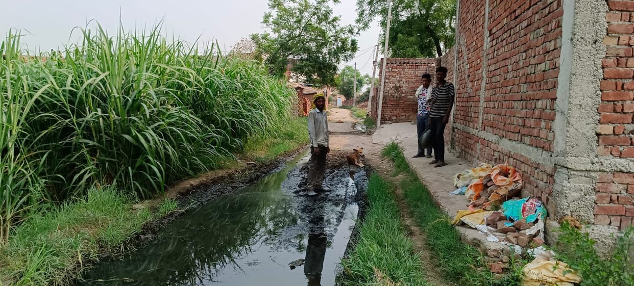 Claims of cleanliness: Villagers' path in Sarai Khadar mired in water and mud
