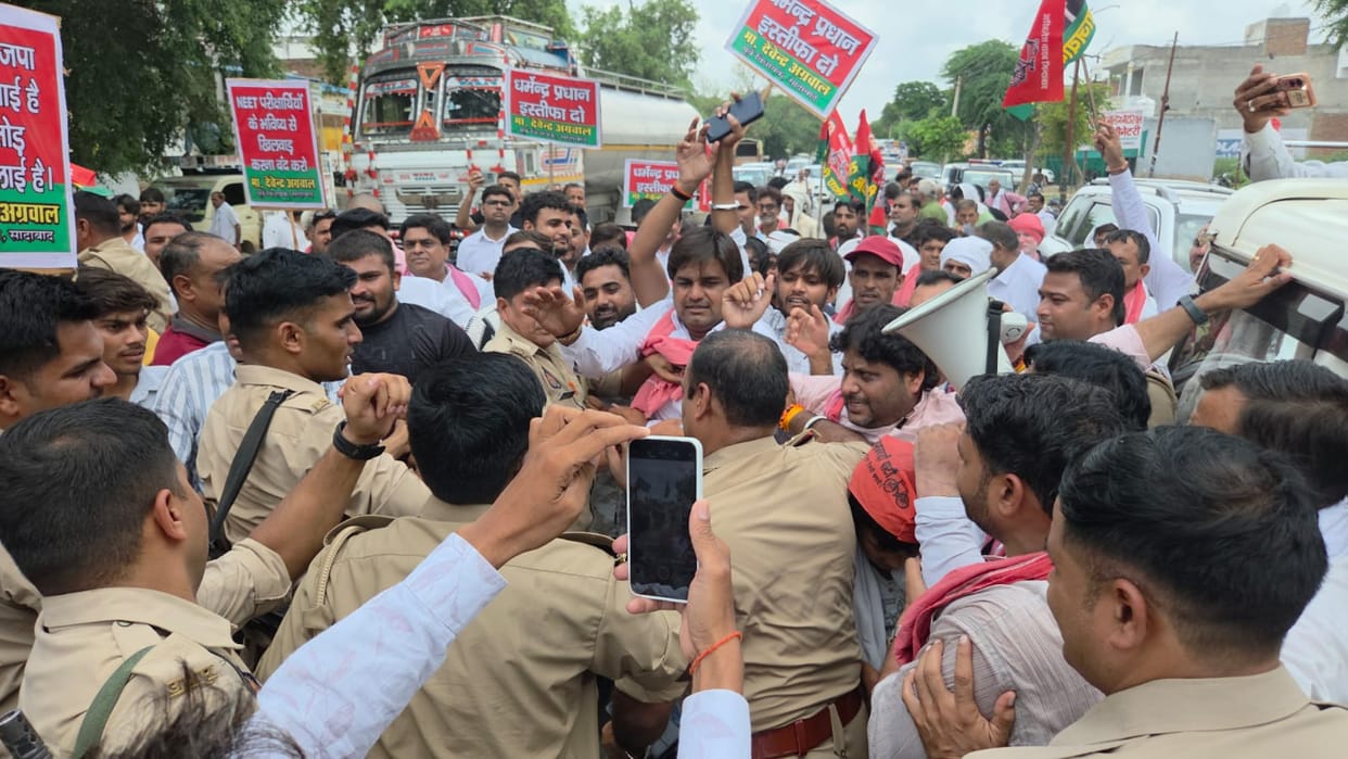 SP workers scuffle with police after procession is stopped.