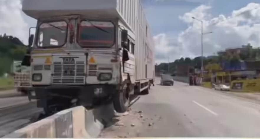 Out-of-control trailer truck speeds along four-lane highway, rams into three vehicles.