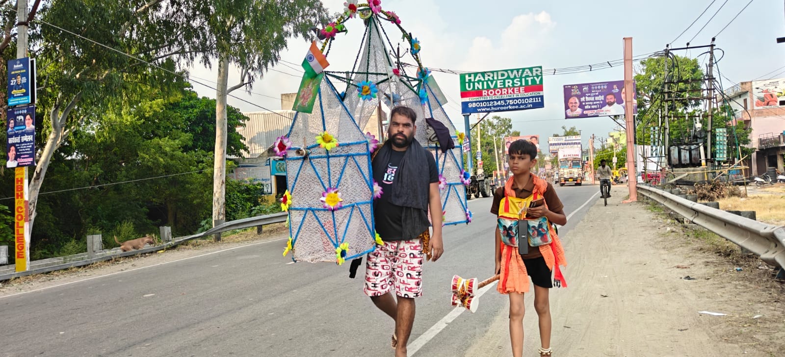 Ten-year-old Himanshu set out with his father, carrying the Kanwar.