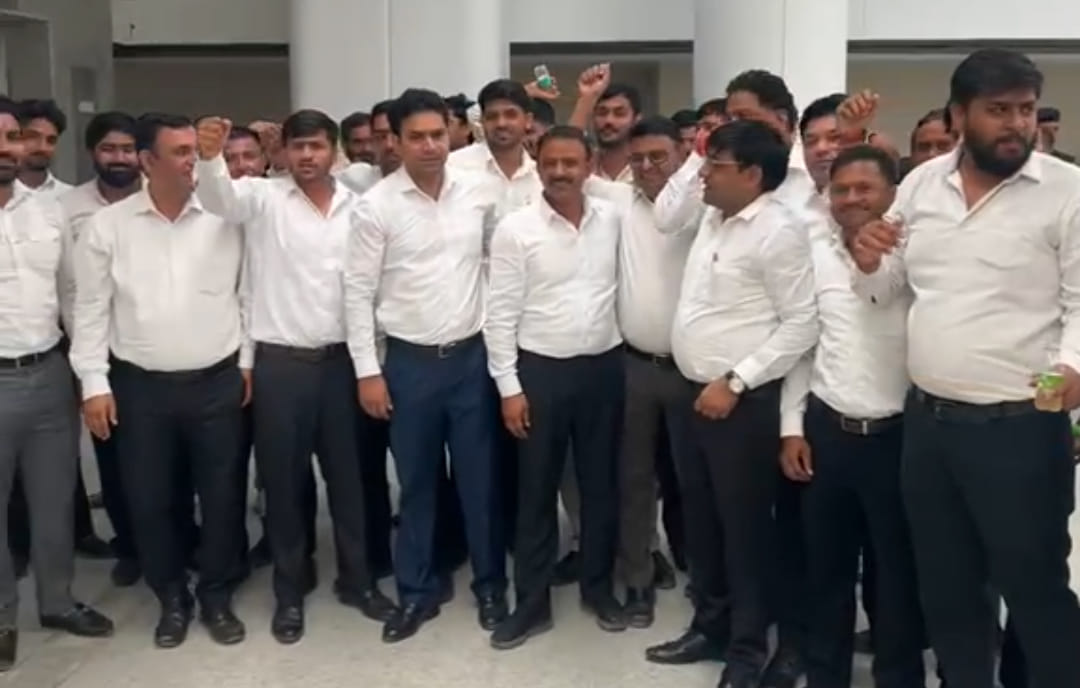 Opposition to the allotment of plots at a distant location; slogans raised during the public hearing.