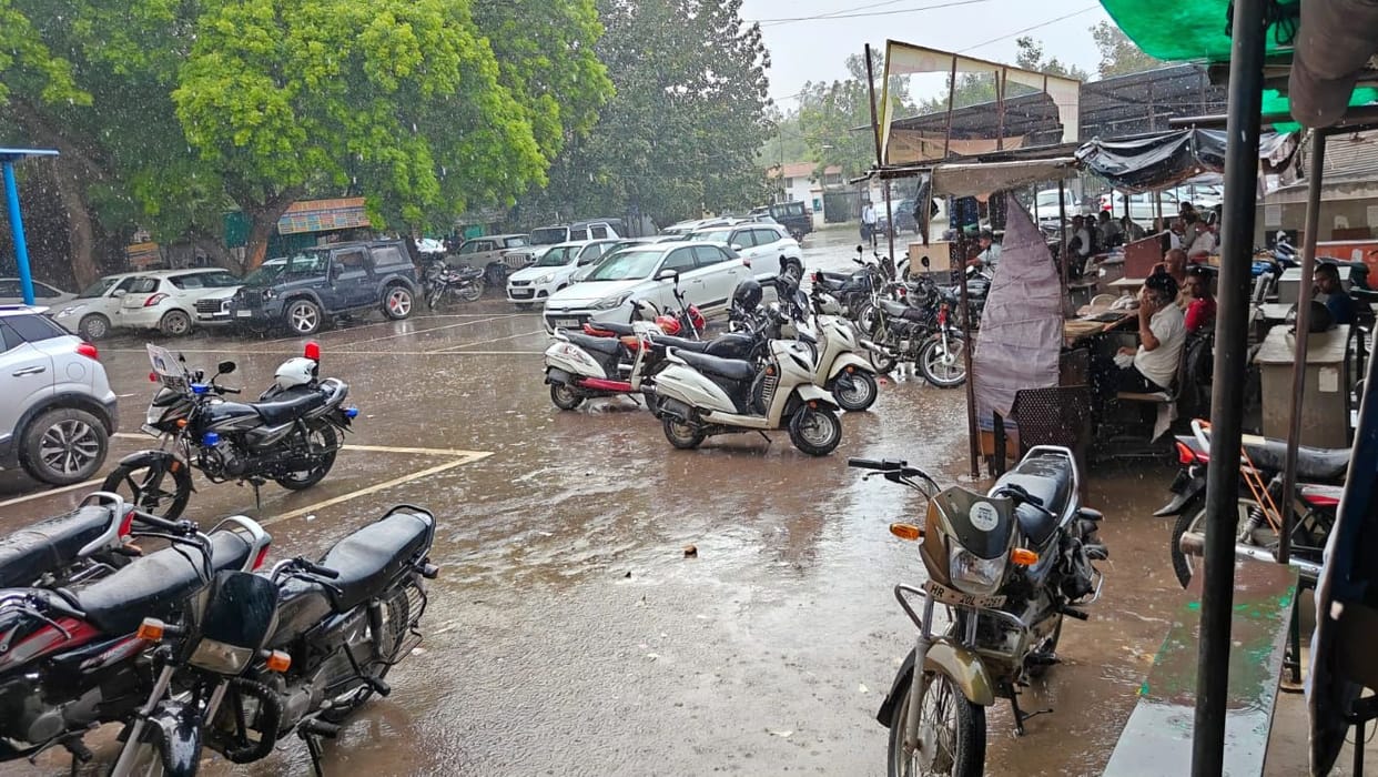 The humid heat made people miserable throughout the day, drizzle did not bring relief.