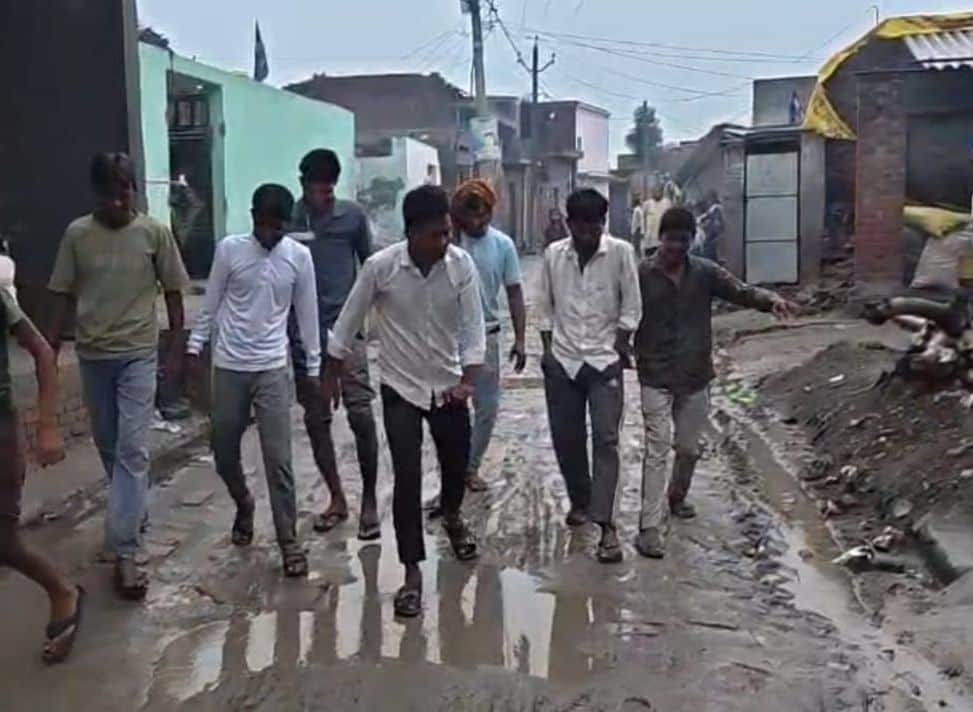 Main road turns into a swamp during the rains, causing severe inconvenience.