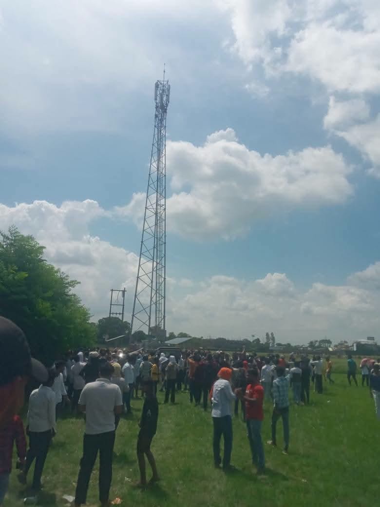 Young woman climbs mobile tower, insisting on marrying her jailed boyfriend.