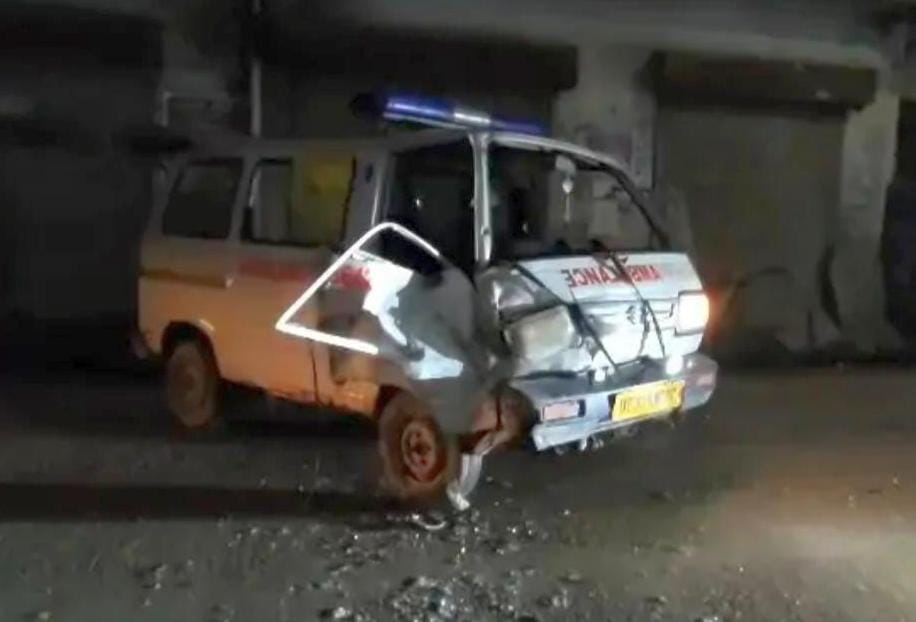 Tractor-ambulance collision; driver injured.