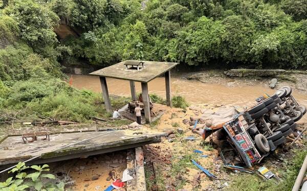 A truck loaded with wheat fell off a bridge near Mile 53, killing two people.