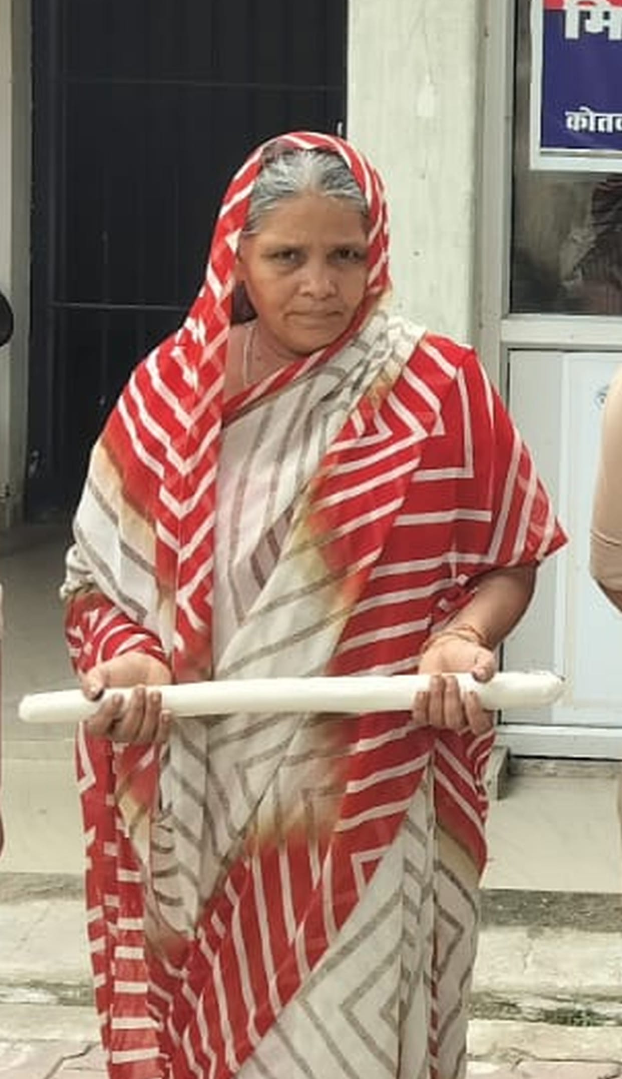 The wife killed her husband by striking him on the head with a stick.