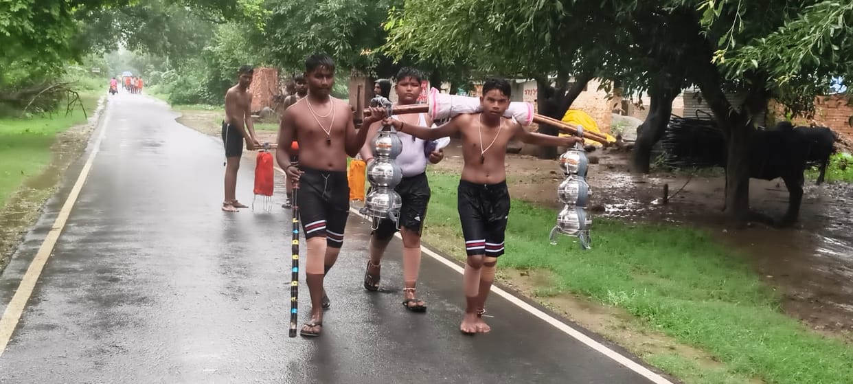 Devotees headed towards the banks of the Ganges, chanting "Bam-Bam Bhole."