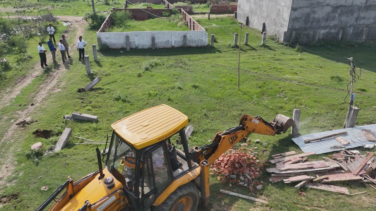 Bulldozers crack down on illegal plotting; two colonies demolished.