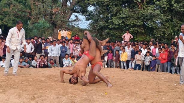 The thrill of the wrestling match at the Darshan Baba fair; wrestlers displayed their techniques and moves.