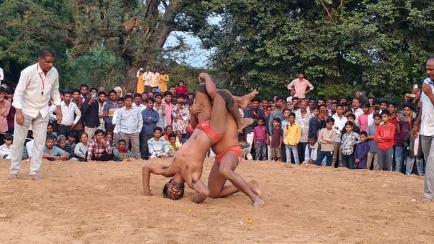 The thrill of the wrestling match at the Darshan Baba fair; wrestlers displayed their techniques and moves.