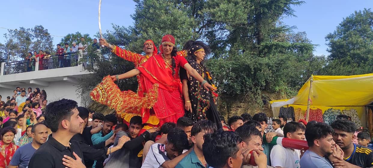 Deity chariots from three villages taken out at the Devidhar Festival; huge crowds gather.