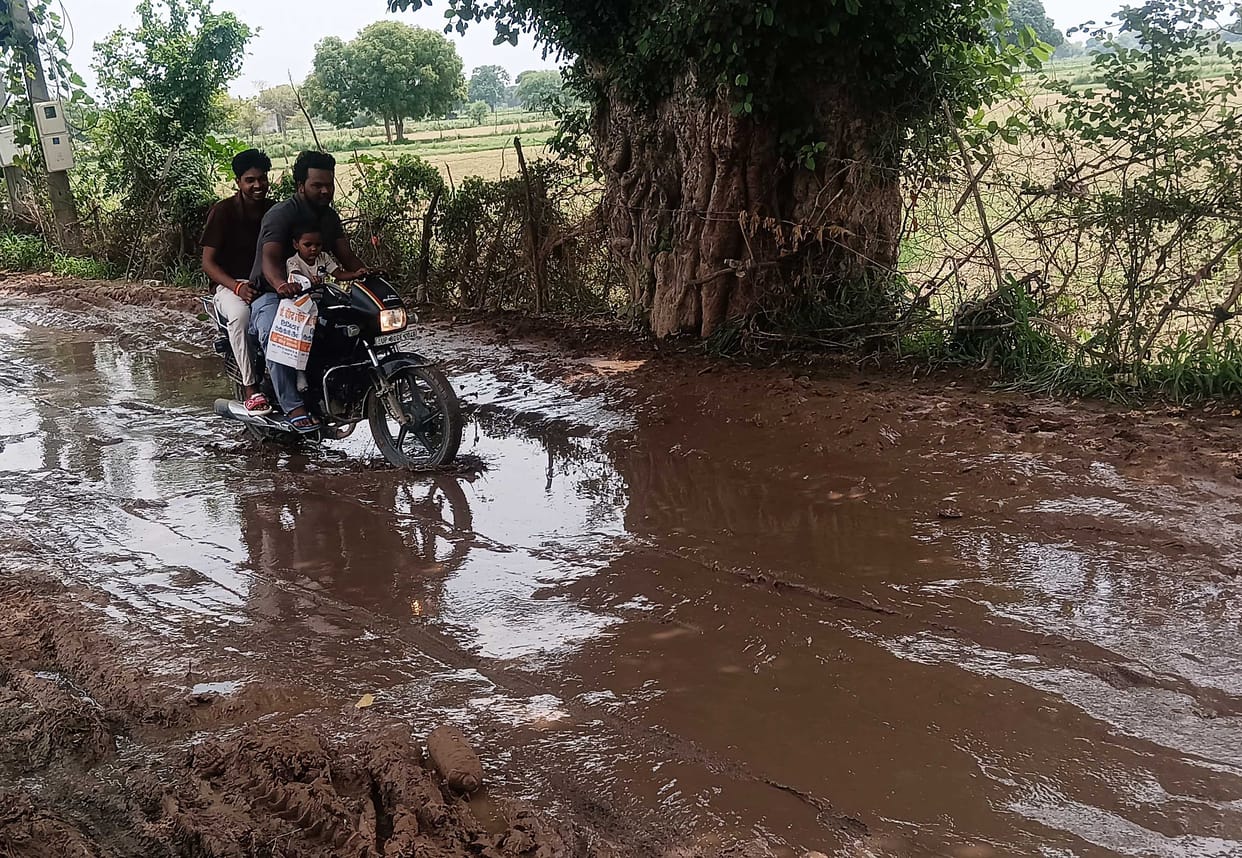 Deadly potholes in the road that has become a pond in Rajarampura