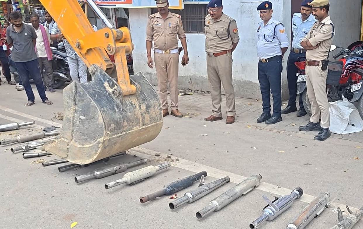 Modified silencers crushed by a bulldozer.