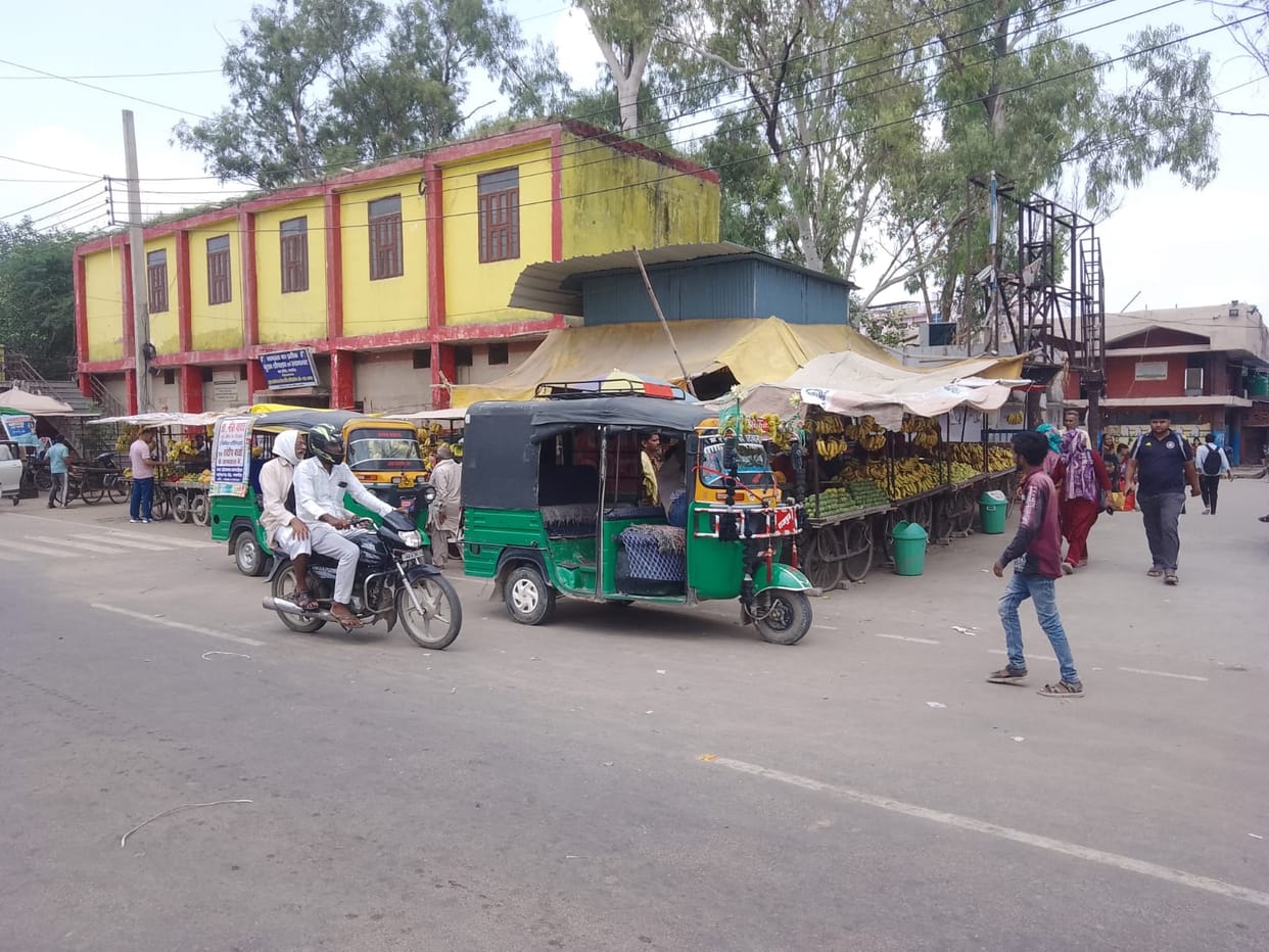 Vehicles parked haphazardly outside the bus stand are causing traffic jams.