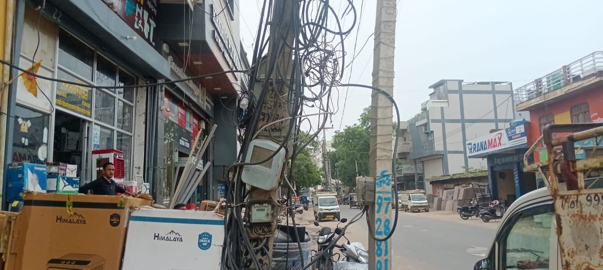 Wires hanging from poles pose a danger; fear of electric shock during rain.