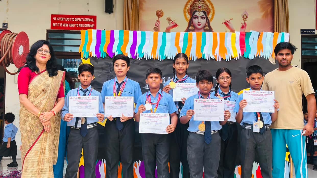 Taekwondo medalists felicitated upon arrival at the academy.