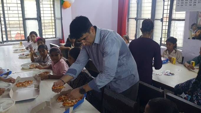 DM treated Kasturba students to pizza.