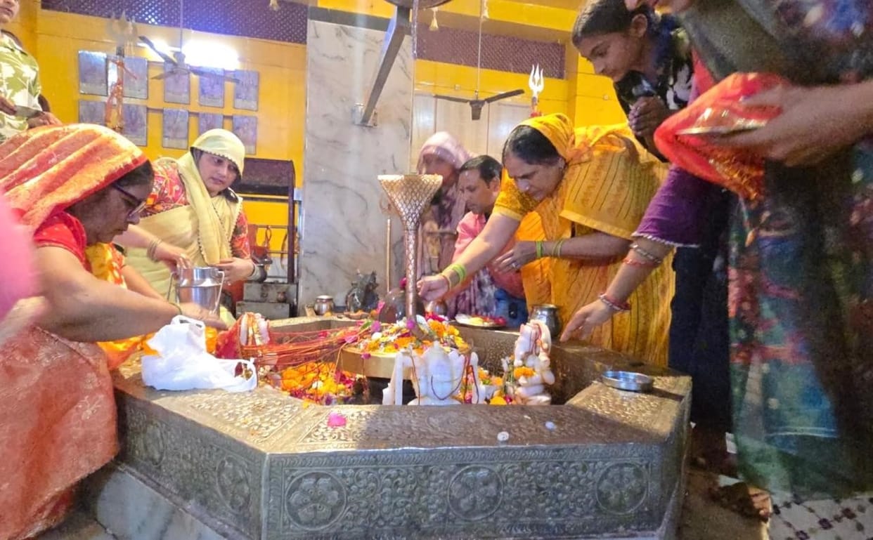Ritual bathing of Shiva idols with water performed at temples on the first day of Sawan; prayers offered for wishes.