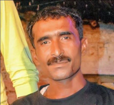 Laborer's body found by the roadside; son was born 13 days ago.