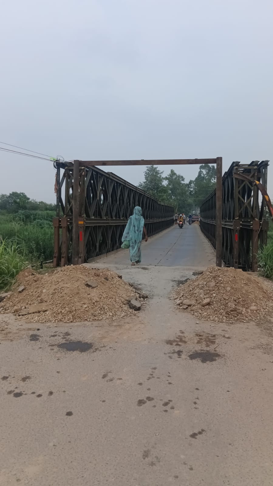 Installation of new height barriers on the Bailey bridge has begun; barriers will also be installed before the bridge.