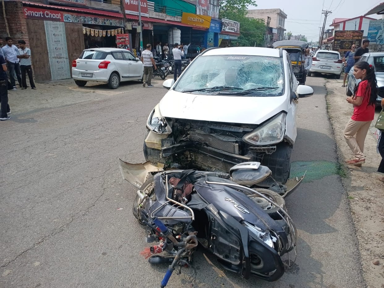 Three youths riding a motorcycle and a scooter injured after being hit by a car.