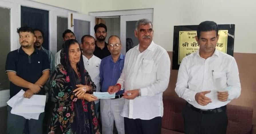 Cheques worth 12 lakh distributed to disaster-affected families.