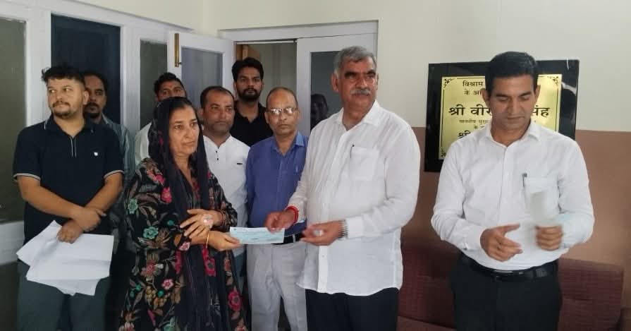 Cheques worth 12 lakh distributed to disaster-affected families.