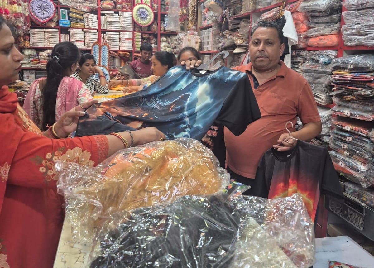 Markets bustle ahead of Kanwar Yatra; sales of saffron attire pick up.