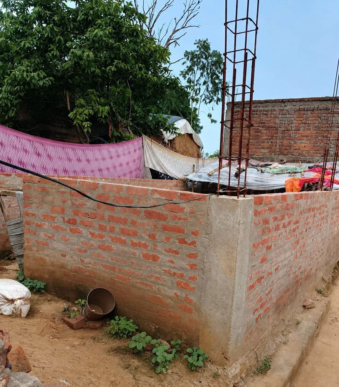 Old houses demolished, work on new ones stalled for seven months; 14 families are making do in the Panchayat building and the school.